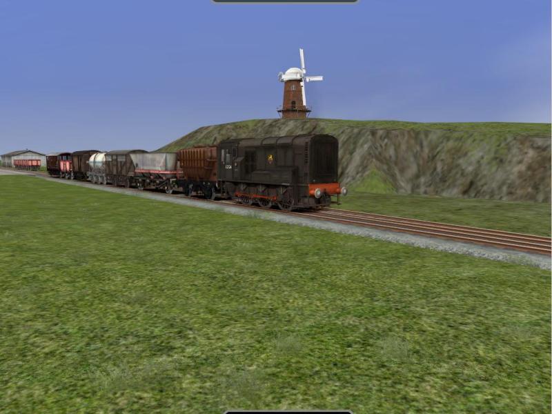 BR Class 08 in black livery with a windmill in the background